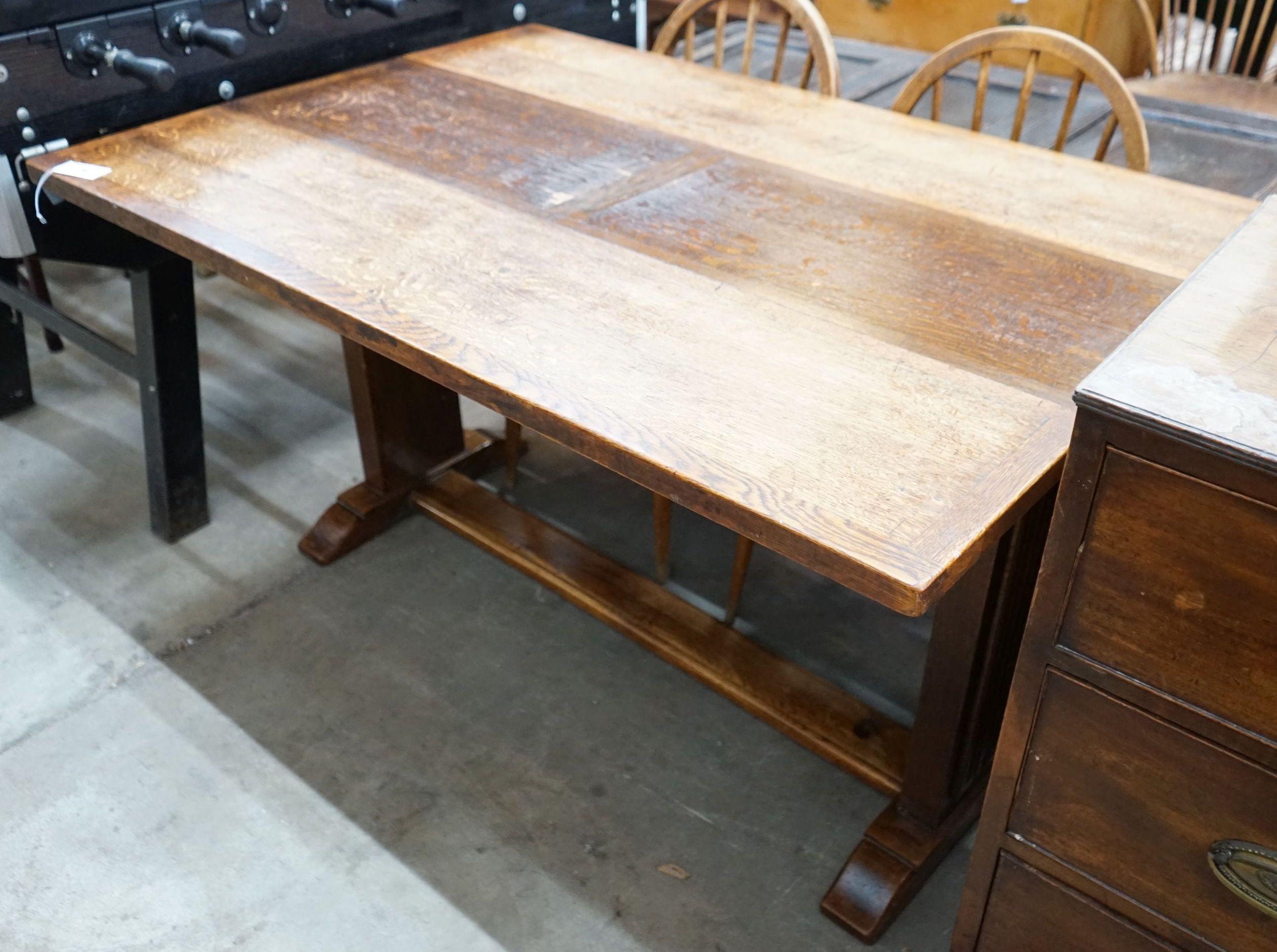 An 18th century style rectangular oak drop leaf extending dining table, depth 136cm, length 94cm extended, height 75cm